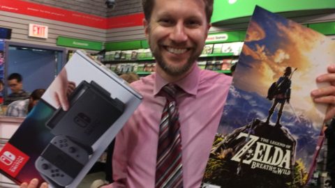 Holding my Switch and Zelda poster