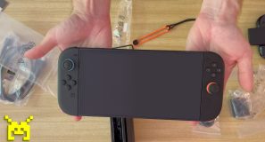 Birds-eye view of two hands holding a recently unboxed Nintendo Switch 2